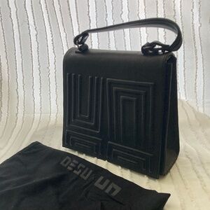 Black saddle leather bag from Desu x UN